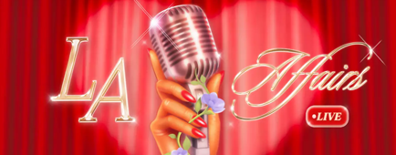 Hand holding a microphone with flowers growing on it.