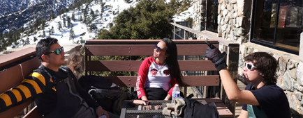 Friends enjoy the sun-drenched deck at Top of the Notch restaurant while visiting Mt. Baldy. Friends enjoy the sun-drenched deck at Top of the Notch restaurant while visiting Mt. Baldy.